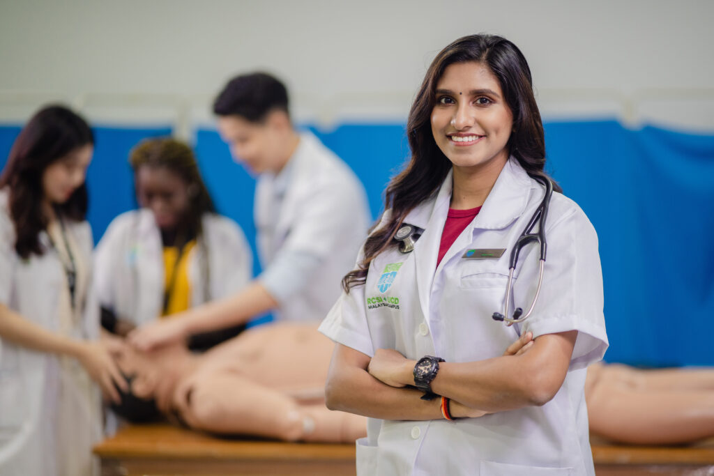 Medical students doing CPR training on a dummy in a hospital.